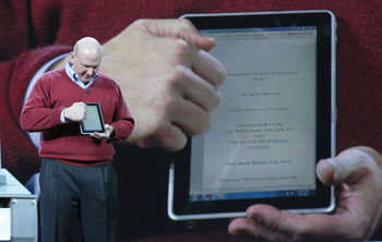 Microsoft CEO Steve Ballmer shows a tablet computer at his CES keynote presentation.