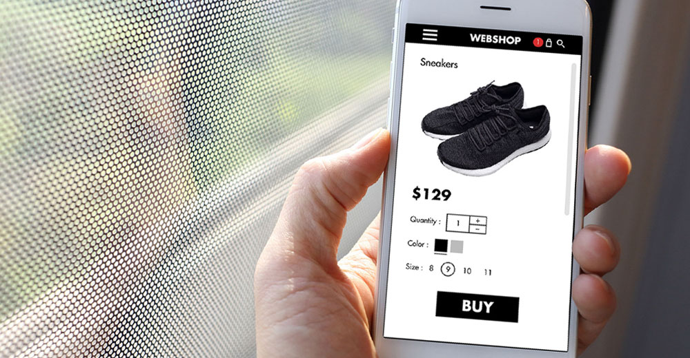 online shopper using a smartphone to purchase sneakers online